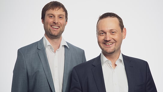 Head of IT Consulting Guido Nippe und Vorstand Matthias Besenfelder lächeln in die Kamera
